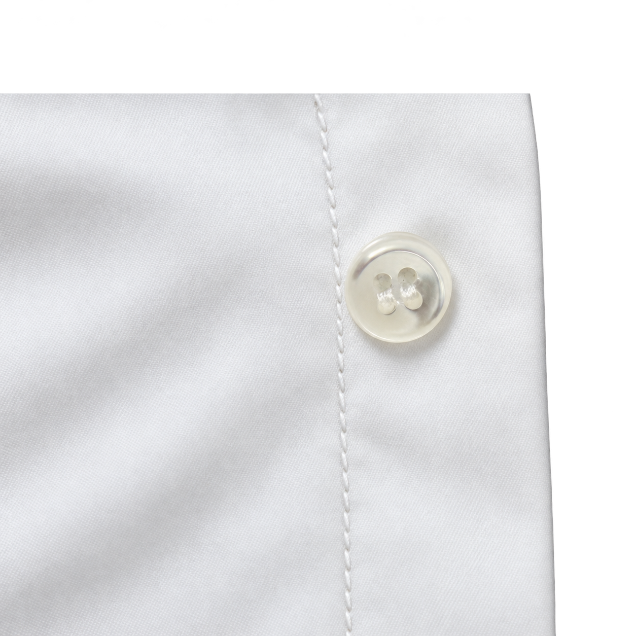 Mother-of-pearl shirt button with a fine reinforcement seam immediately beside it on the body side of the front